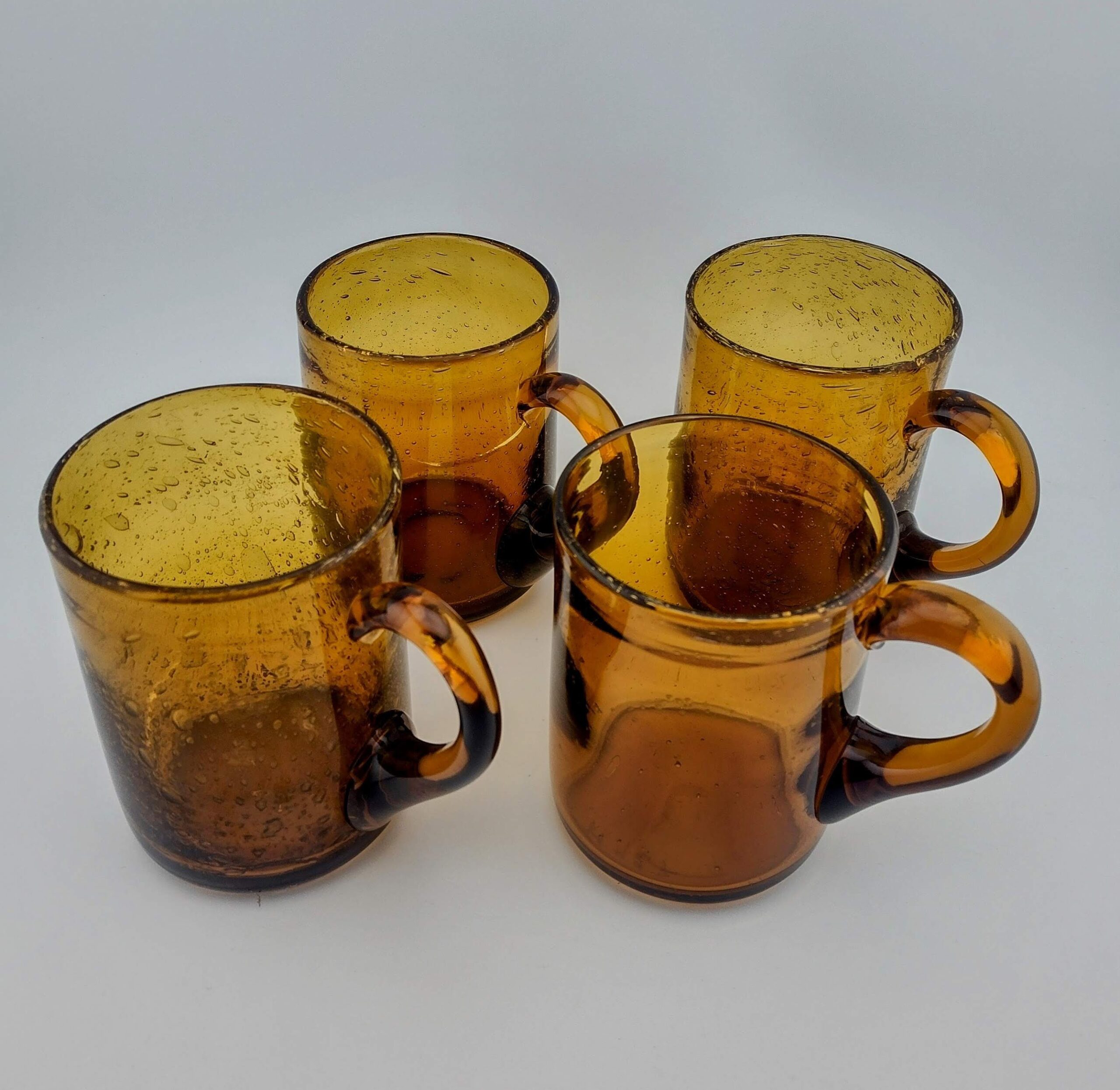 ERIK HÖGLUND FOR KOSTA BODA MODEL H927 AMBER SEEDED MUGS