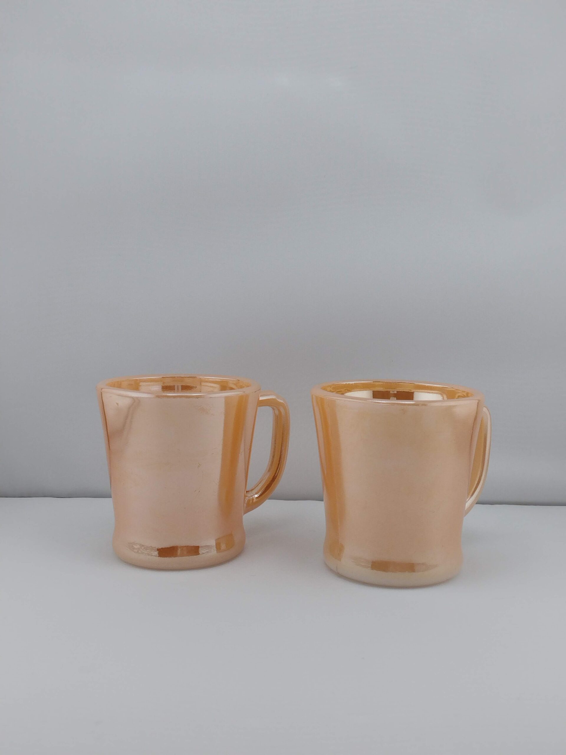 Anchor Hocking Peach Lustre Fire King mugs, set of 2